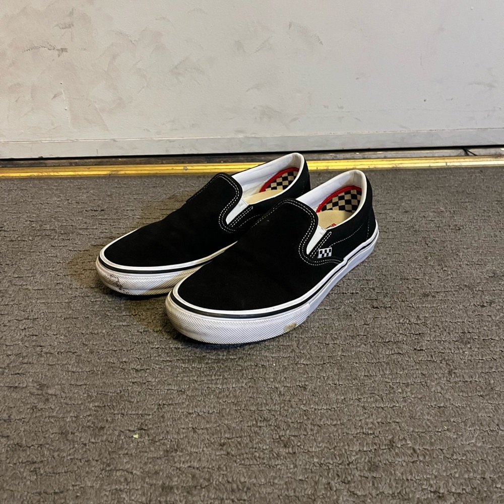 Vans Black and White Slip-On Sneakers